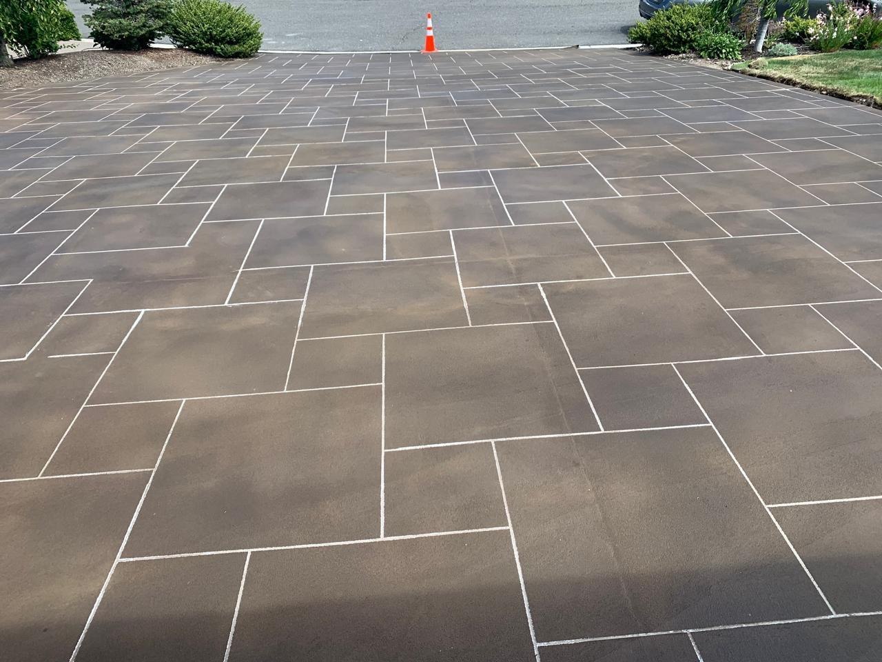 Dark charcoal scored driveway